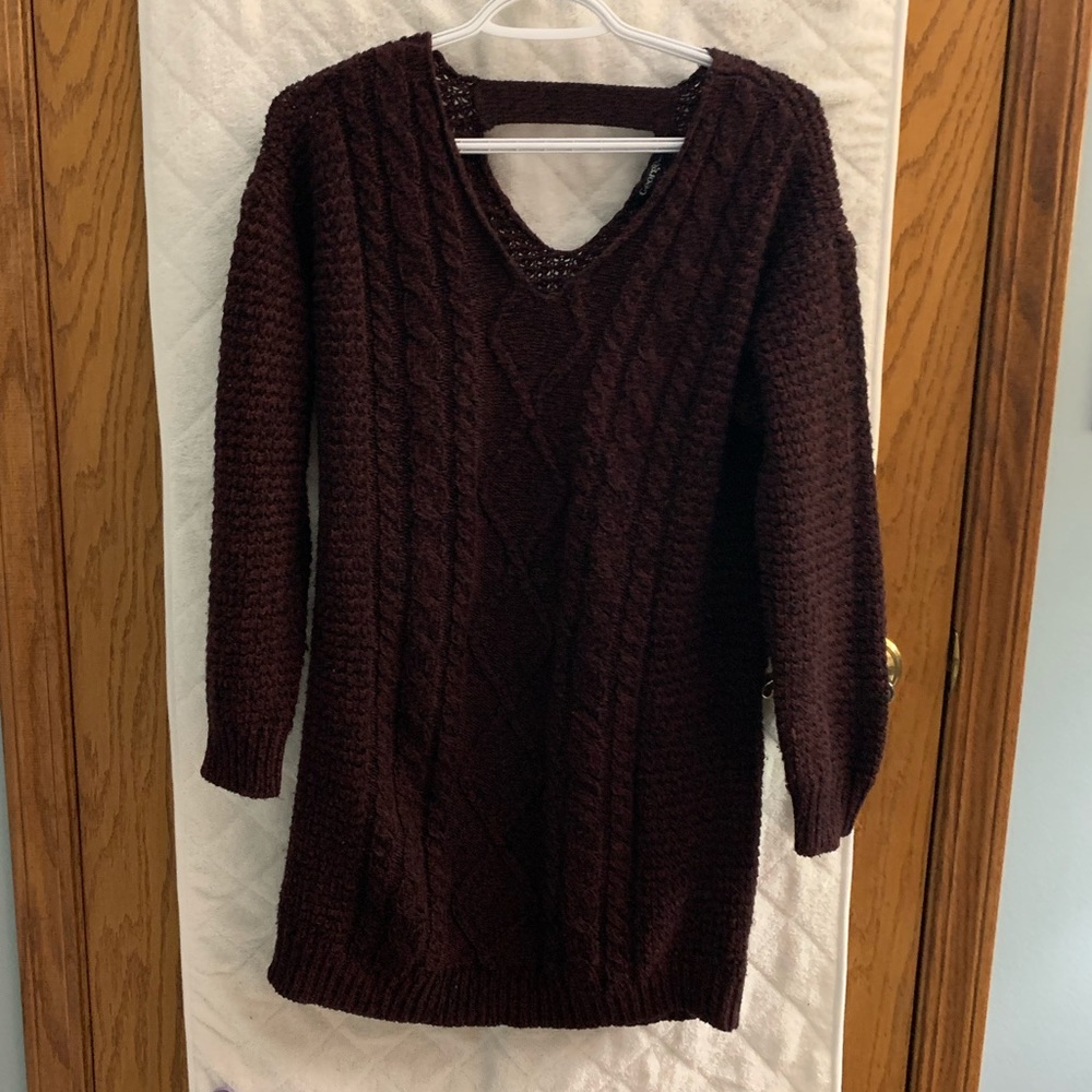A purplish/red knit George sweater, size medium